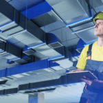 technician-helmet-tablet-inspecting-ventilation-600nw-2687827113